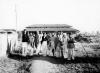 Gandhi walking with coresidents, 1944